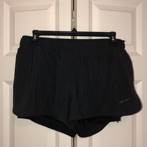 Black Nike running shorts